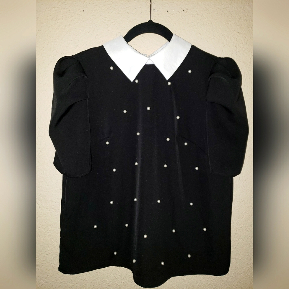 Beautiful black white pearl white collar elbow length blouse.